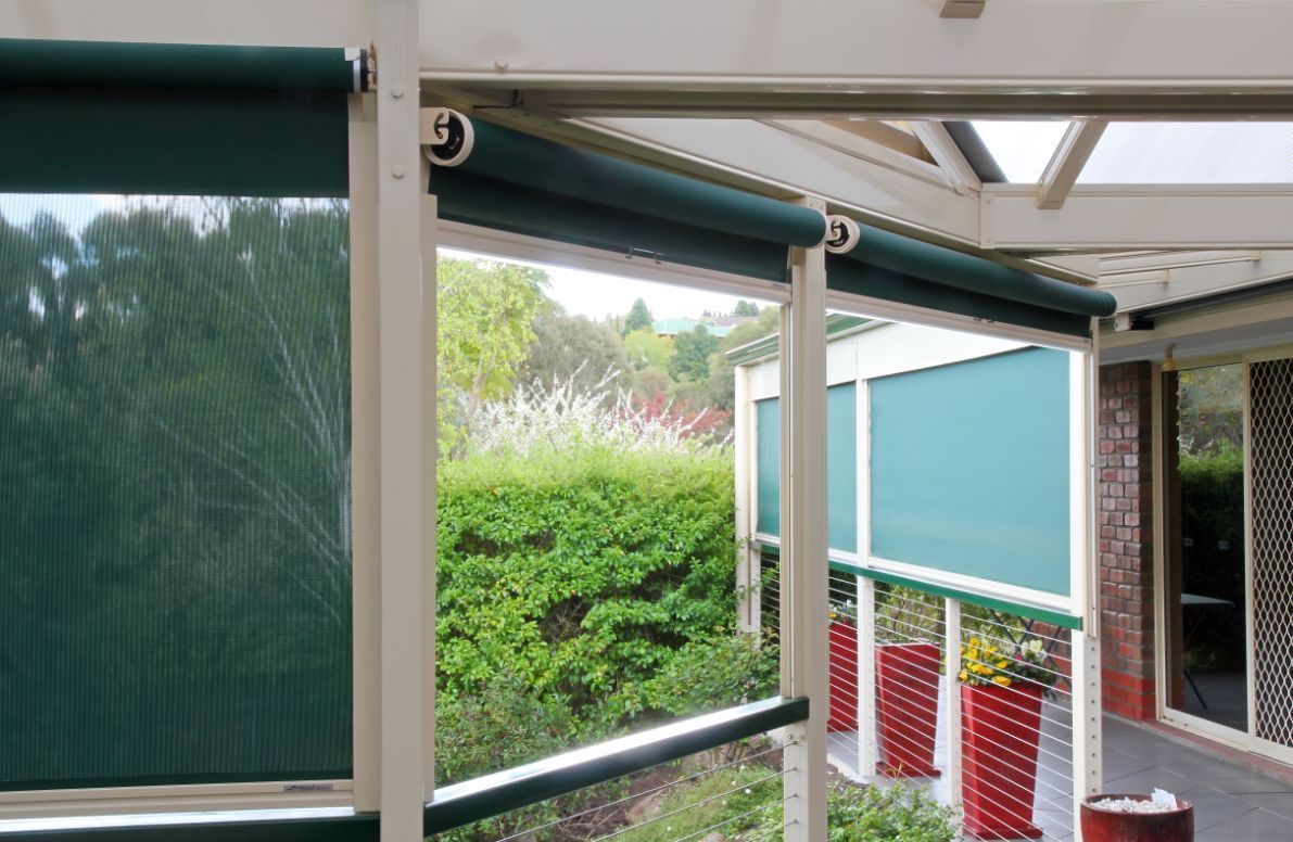 A House With a Porch With Green Blinds on It — South Burnett Garage Doors In Blackbutt, QLD