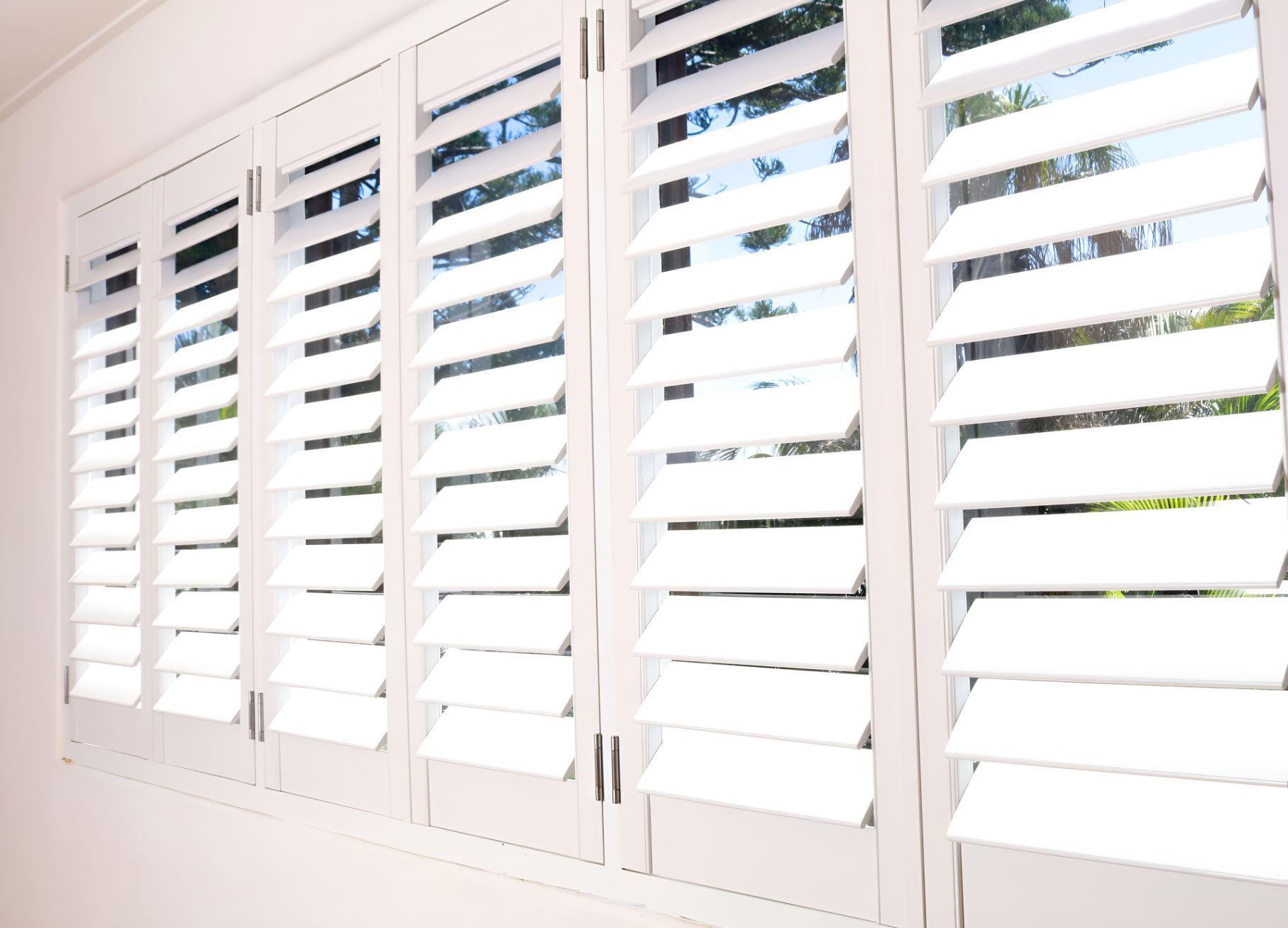 A Window With a Lot of White Shutters on It — South Burnett Garage Doors In Kingaroy, QLD