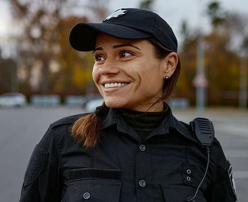 Safety Officer Holding Portable Radio Transceiver — Cleveland, OH — Safe Choice LLC Safety Officer Holding Portable Radio Transceiver — Cleveland, OH — Safe Choice LLC