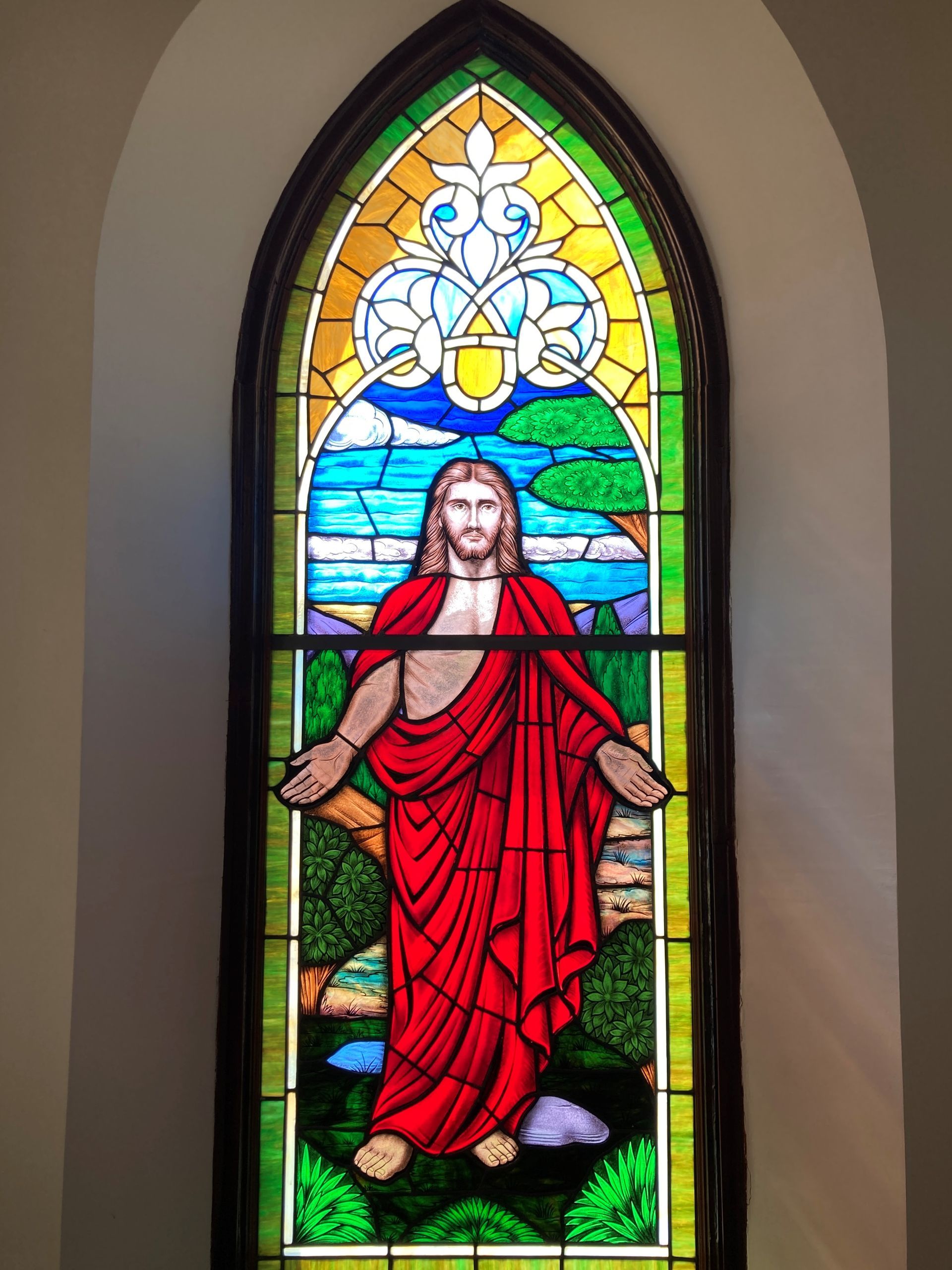 Jesus with open arms, stained glass window. (in Narthex of Sanctuary)