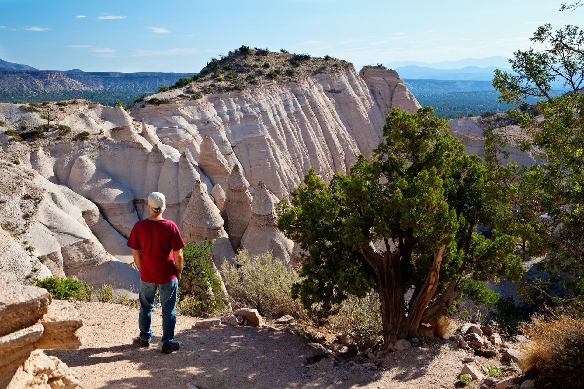Hiker exploring National Conservation Lands on a clear summer day, highlighting public land access and outdoor recreation.