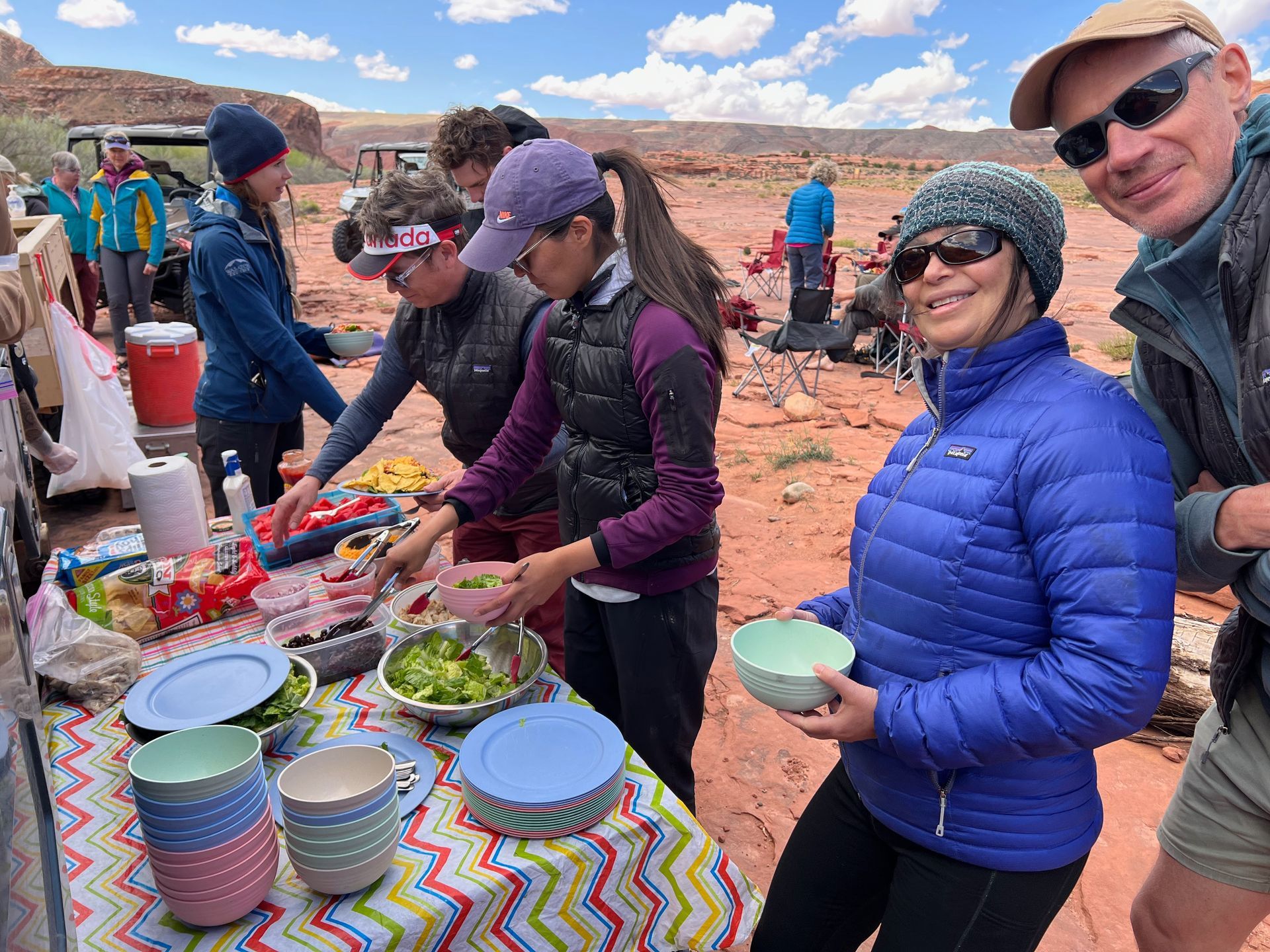 People serving food outdoors