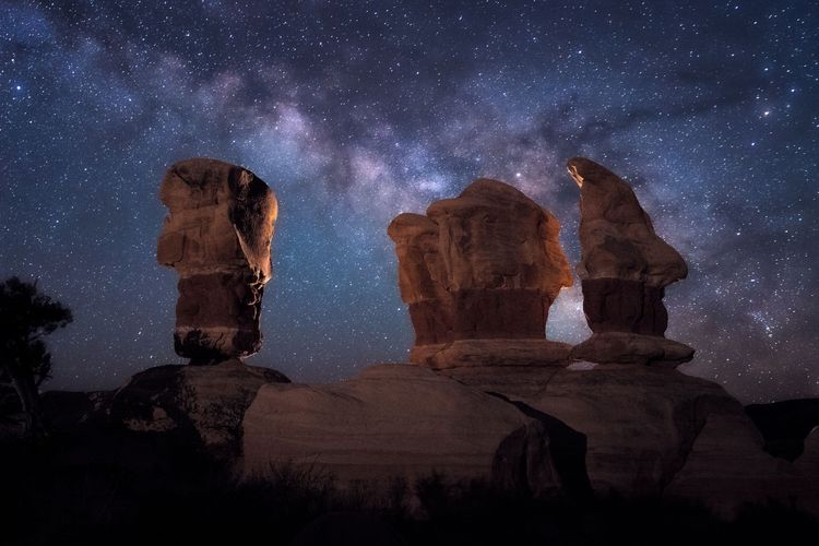 Starry night sky with rocks