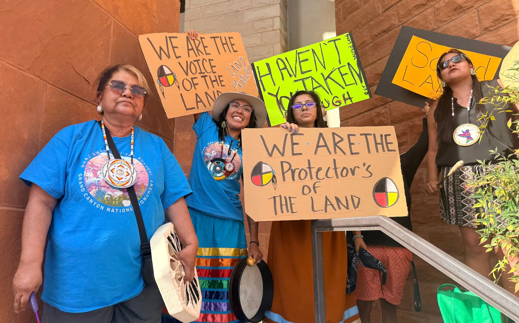 Community members at a rally with signs