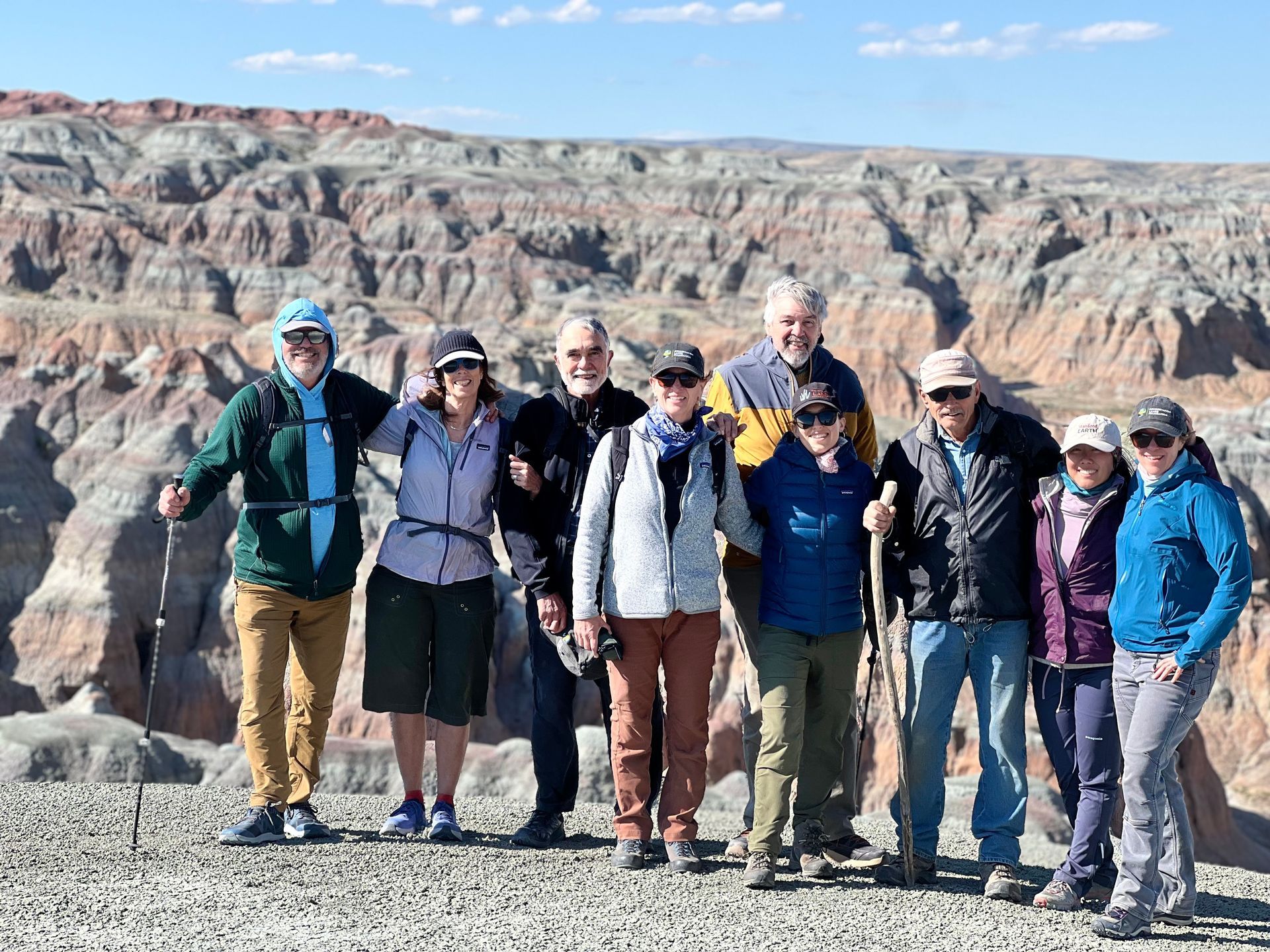 People in front of a desert landscape