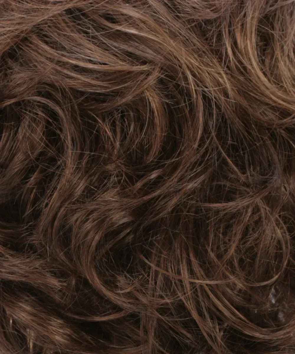 Close-up of wavy, dark brown hair with lighter highlights.