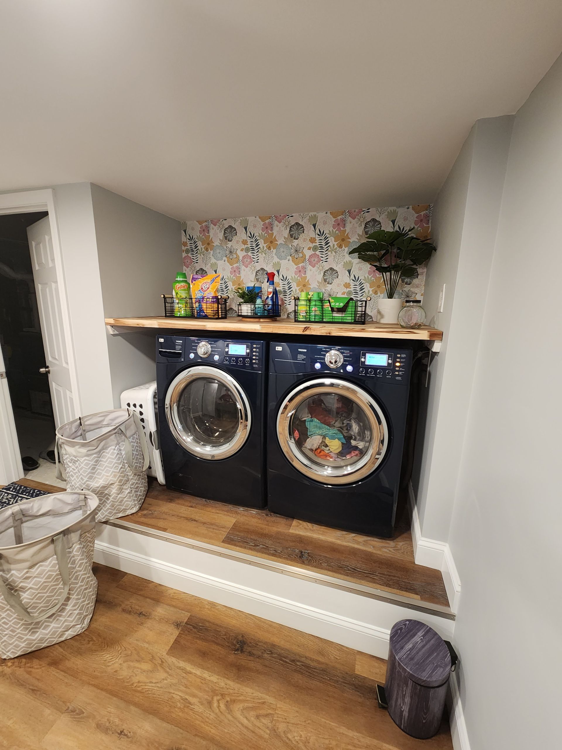 A laundry room with a washer and dryer in it.