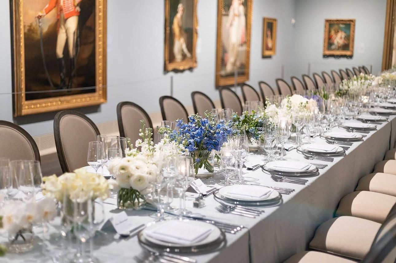 Seated event with florals and table setting