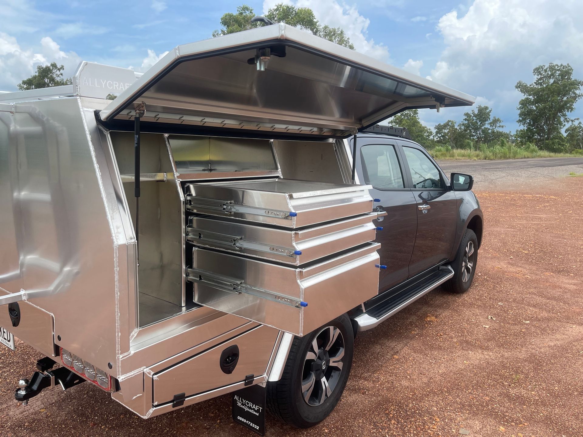 The Back of a Truck with the Canopy Open and Drawers — Allycraft Modifications in Palmerston, NT