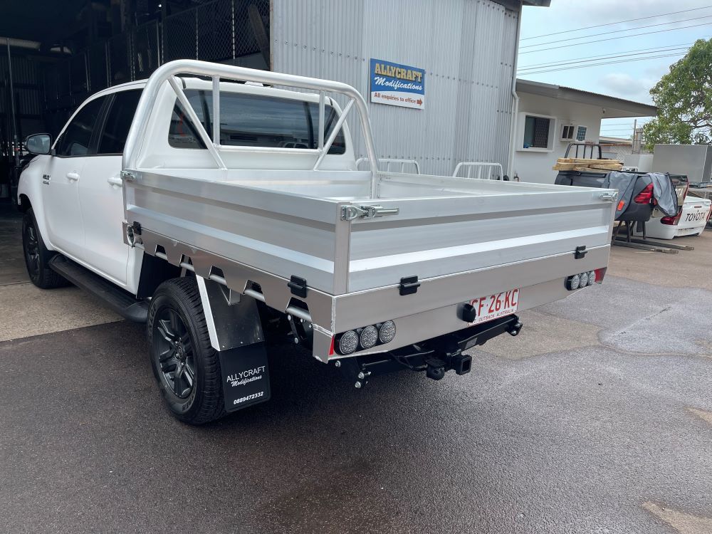A White Truck With a Tray on the Back is Parked — Allycraft Modifications in Berrimah, NT