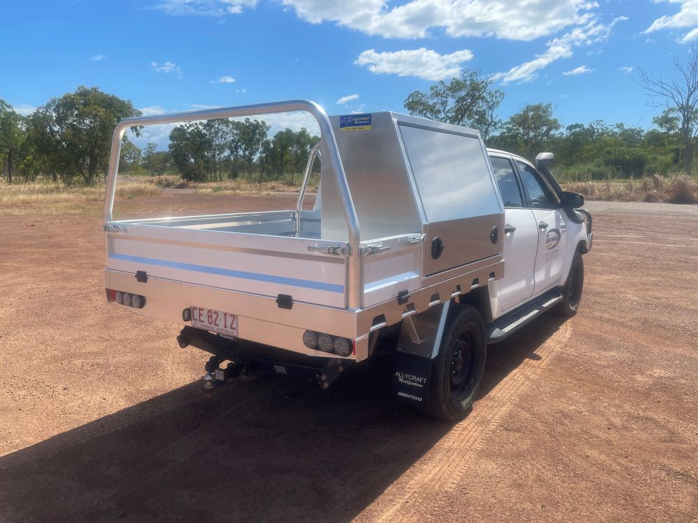 A White Truck With a Canopy is Parked on a Road — Allycraft Modifications in Berrimah, NT