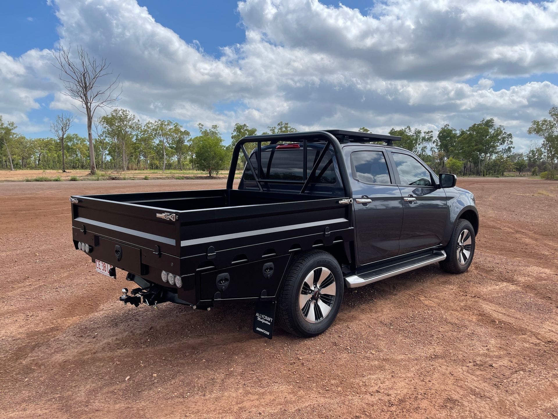A black ute on a dirt patch — Allycraft Modifications in Palmerston, NT