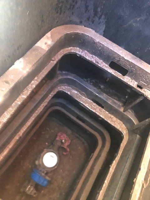 A close up of a metal container with a white circle in the middle