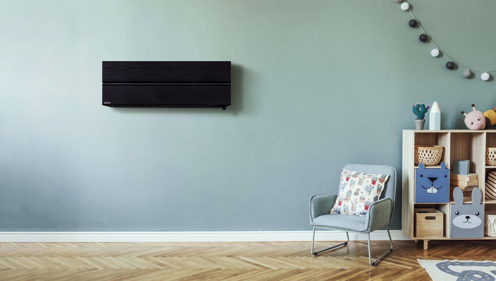 A white air conditioner is mounted on a brick wall.