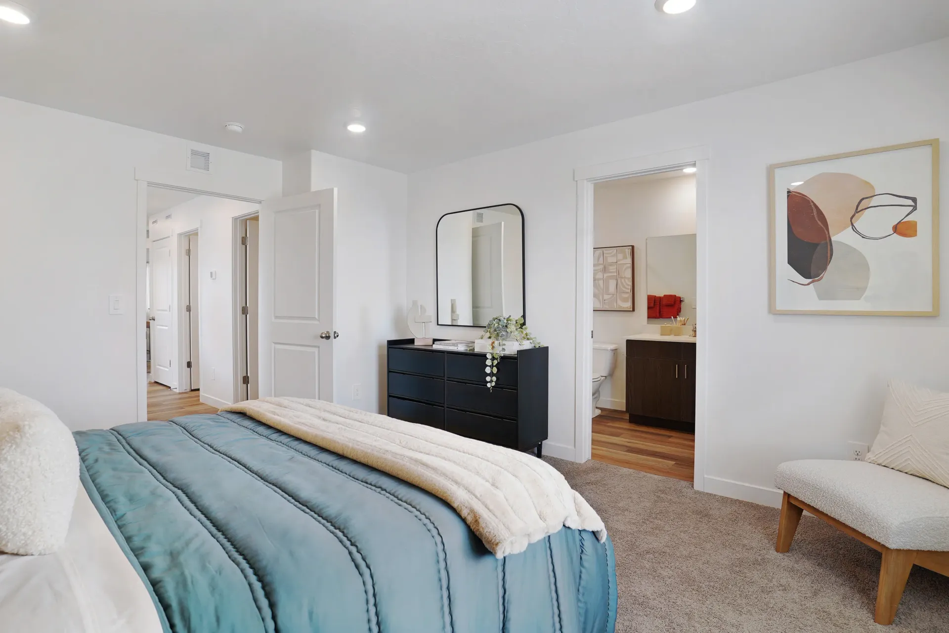 Bedroom and bathroom with modern decor at Little Valley, offering  pet-friendly apartments in Magna, UT.