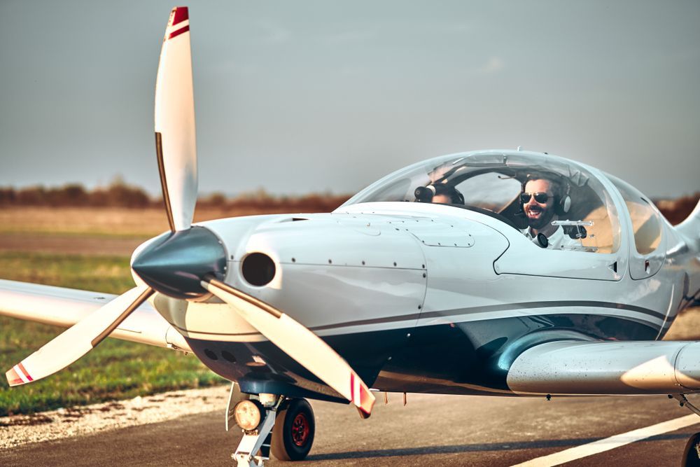 a pilot in traning sits in their training plane learning the difference between vfr and ifr flying