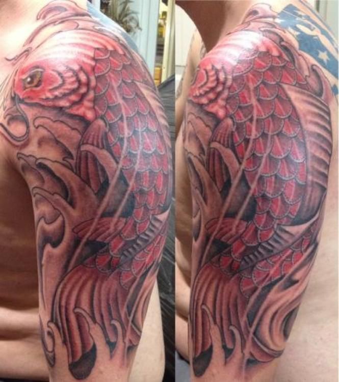 Red koi fish tattoo on a person's upper arm, surrounded by waves in gray.