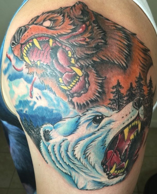 Tattoo of two snarling bears: brown and orange grizzly above, white polar bear below, set in a mountain and forest scene.