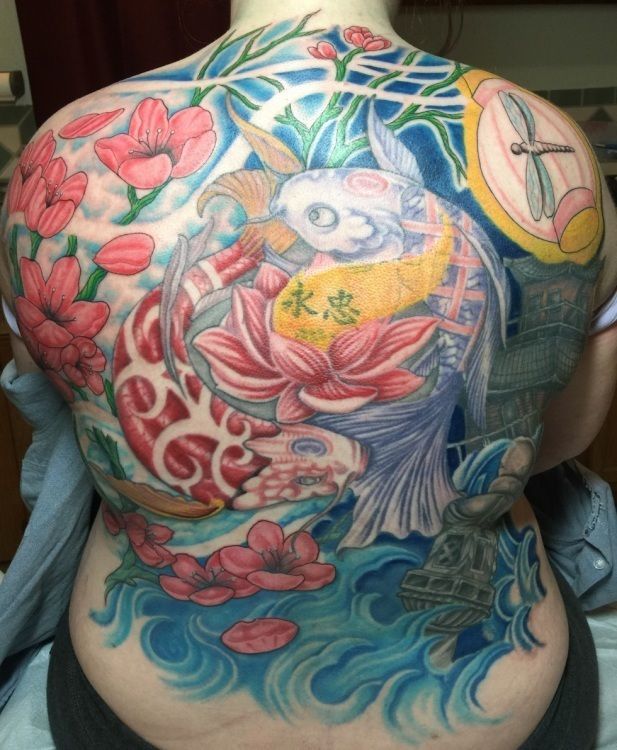 Full back tattoo of koi fish, flowers, and water in vibrant blue, pink, and yellow colors.