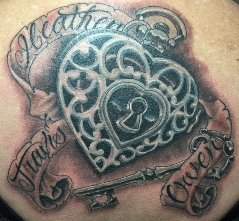 Heart-shaped locket tattoo with 