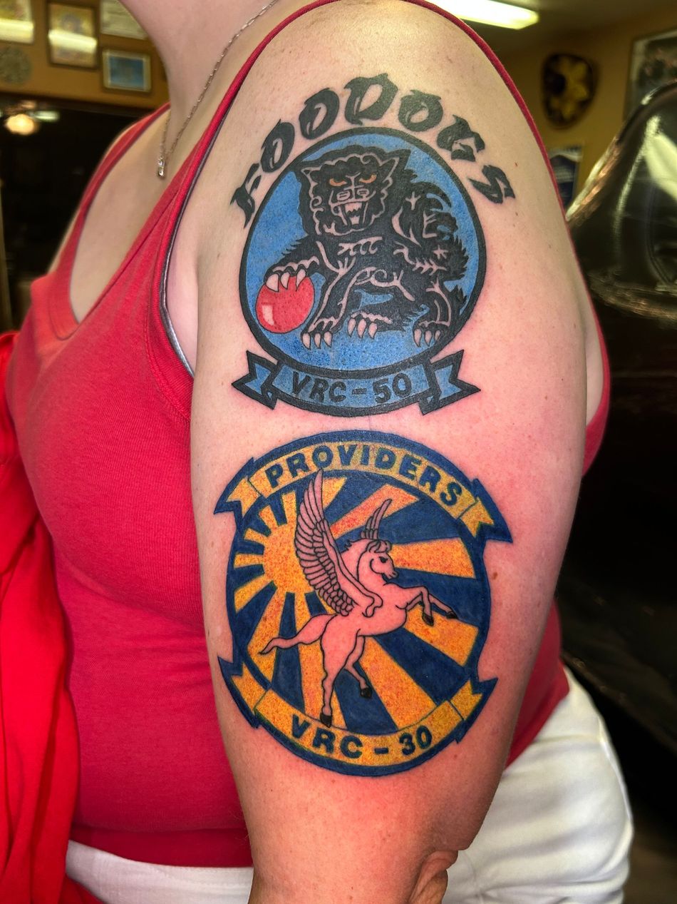 Tattoos on a person's upper arm: 