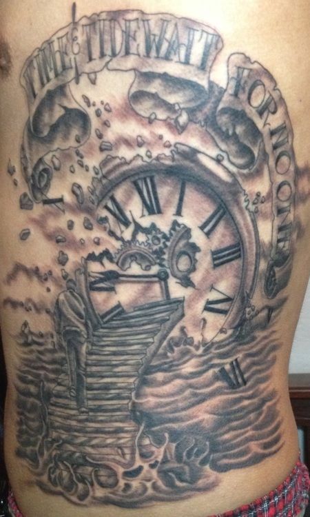 Tattoo of a broken clock with a staircase leading into it, surrounded by clouds and water, with text.