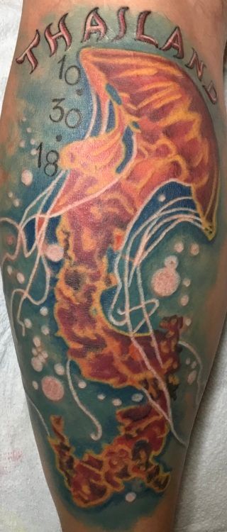 Tattoo of a jellyfish and the country's name, 