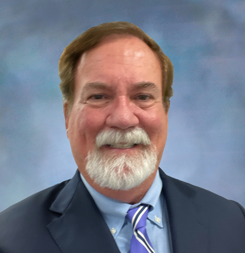 a man with a beard wearing a suit and tie