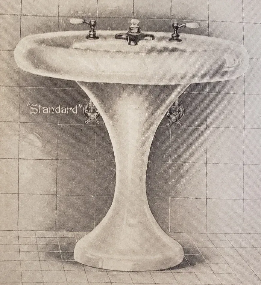 A black and white drawing of a standard pedestal sink
