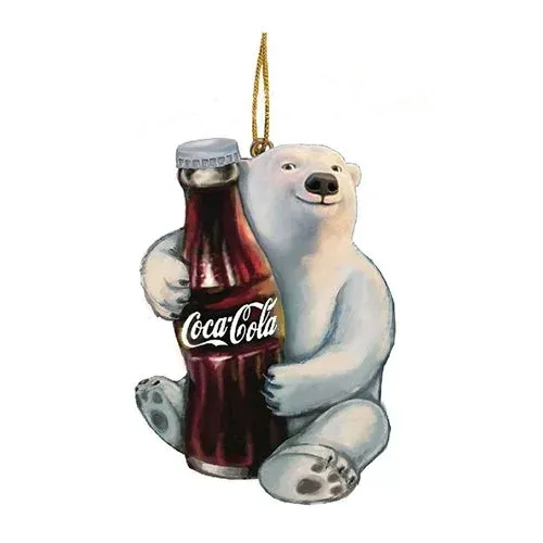 A polar bear is holding a bottle of coca cola.