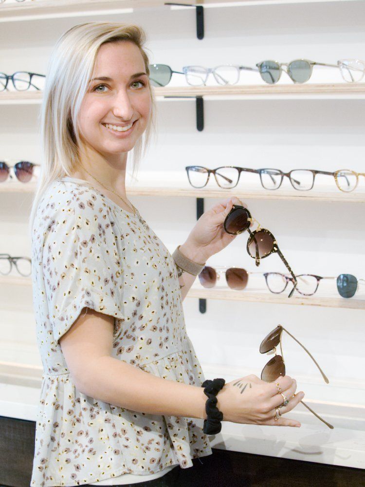 optician showing available frames at Blake Bush Family Eye Care