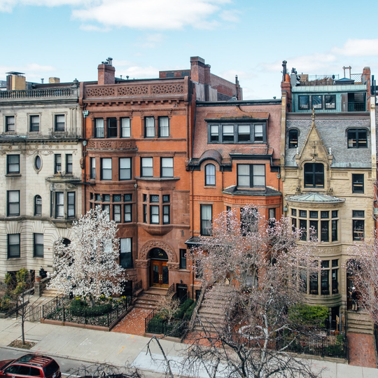 photo of a Boston street with a row of brownstone homes