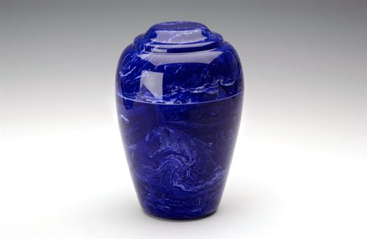 Blue ceramic vase with a glossy finish and narrow neck on a white background