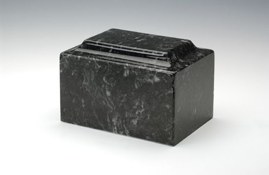 Black rectangular stone urn with a lid on a white background