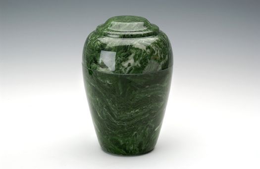 Green polished stone urn with a rounded lid on a white background