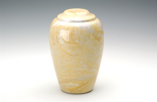 Pale yellow decorative ceramic vase on a white background