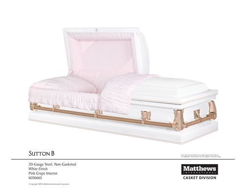 Pink upholstered daybed with white bedding and gold frame, shown in a furniture catalog.