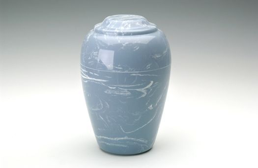Blue-gray ceramic urn with a lid on a white background