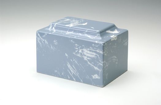 Light blue metal box with a hinged lid and scuffed surface on a white background