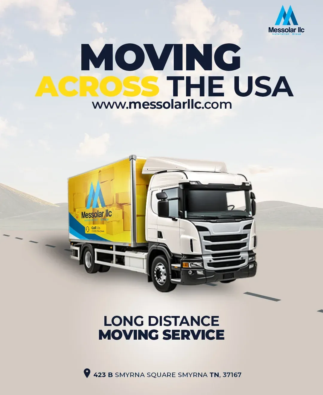 A moving truck is driving down a road.