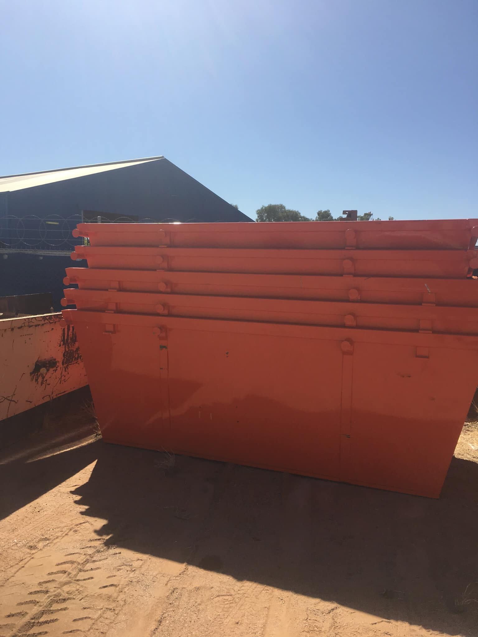 Orange Skip Bins Stacked on Top of Each Other — Alice Skip Hire in Alice Springs, NT