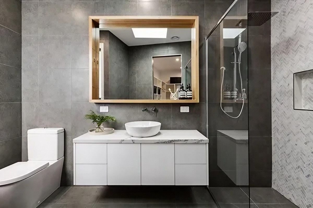 A Bathroom with A Toilet, Sink, Mirror and Shower — Bestbuy Kitchens in Yandina, QLD