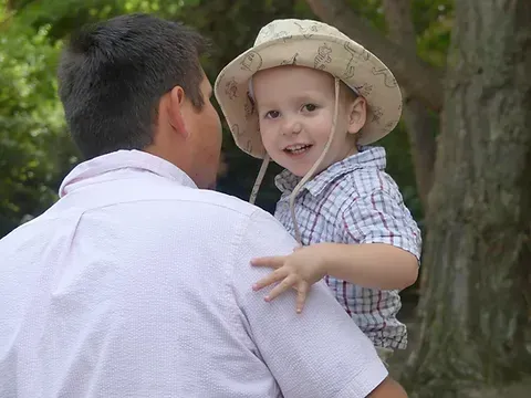 Man Holding a Baby