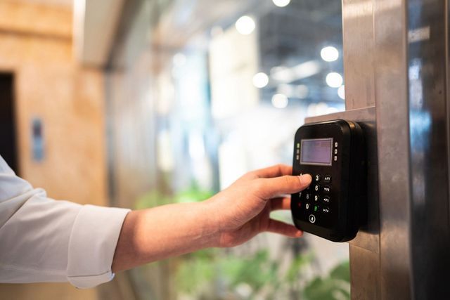 Woman Accessing Door Lock System