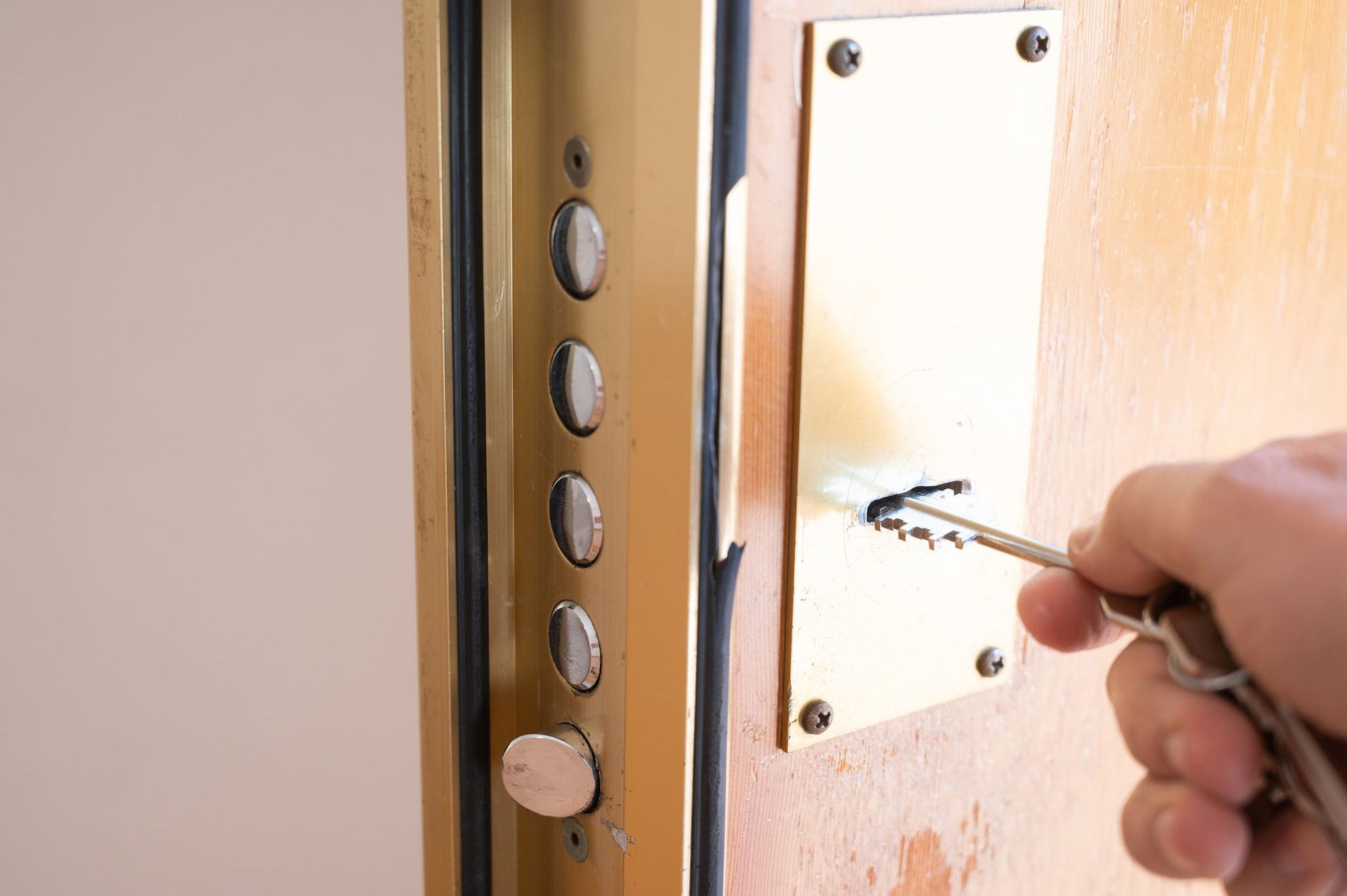 Man Using Key to Open His House