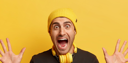 man with open mouth showing white composite fillings