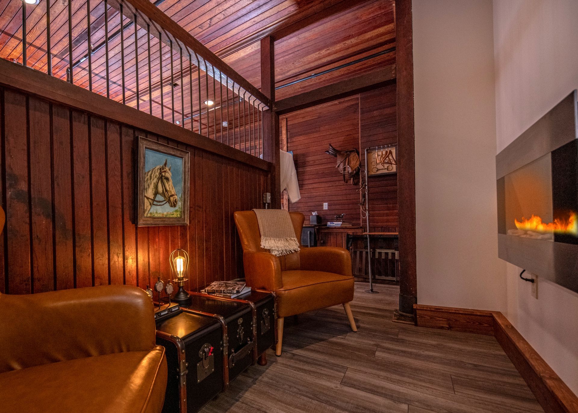 A living room with two chairs and a fireplace.