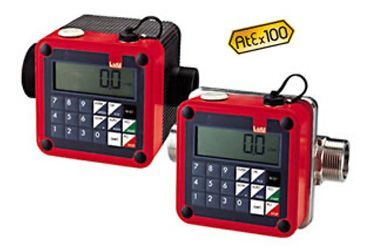 Lutz digital flow meters are sitting next to each other on a white surface .
