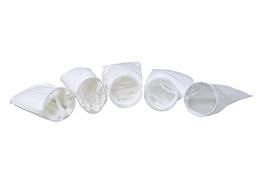 a group of filter bags sitting on top of each other on a white background .