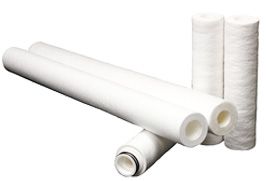 a group of melt blown filters stacked on top of each other on a white background .